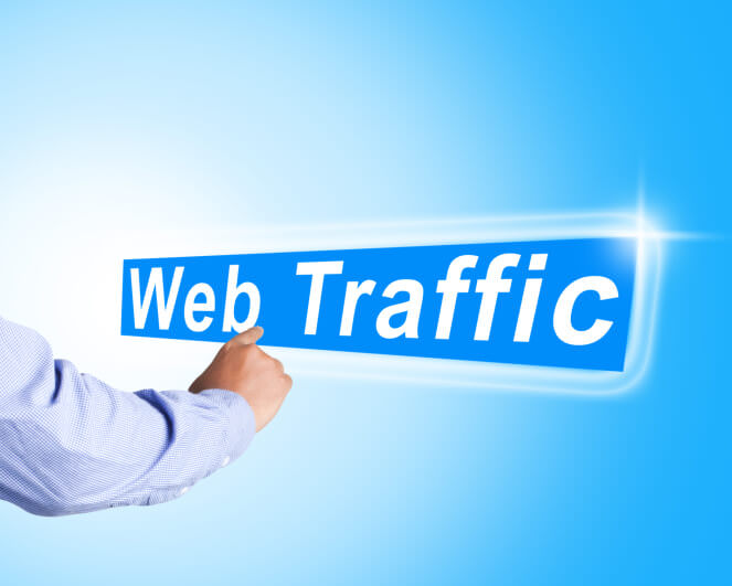 Business man hand touch web traffic text on abstract background